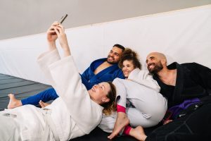 Martial arts fighters taking a selfie after training session